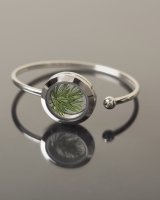 Steel bracelet with pine needles